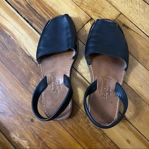 Black leather sandals. Made in Spain.